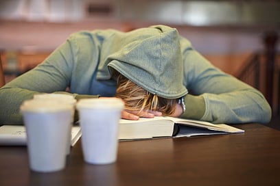 Image of a woman sleeping on a book Image of a woman sleeping on a book