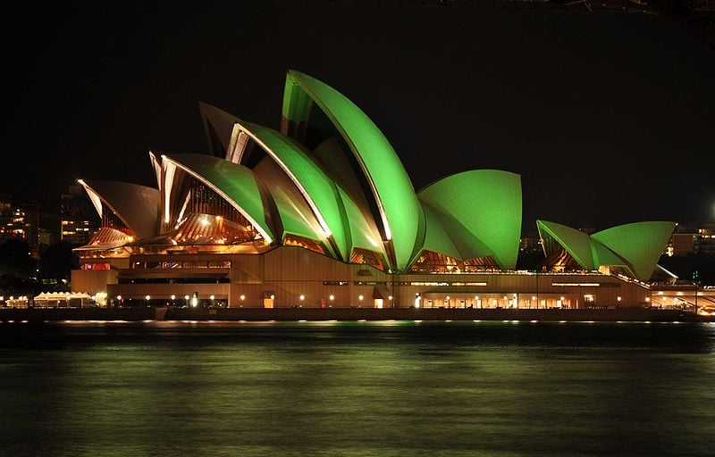 Image of the Sydney Opera House glowing green