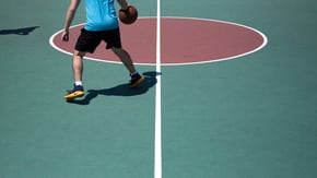 Image of a basketball player dribbling across cultures