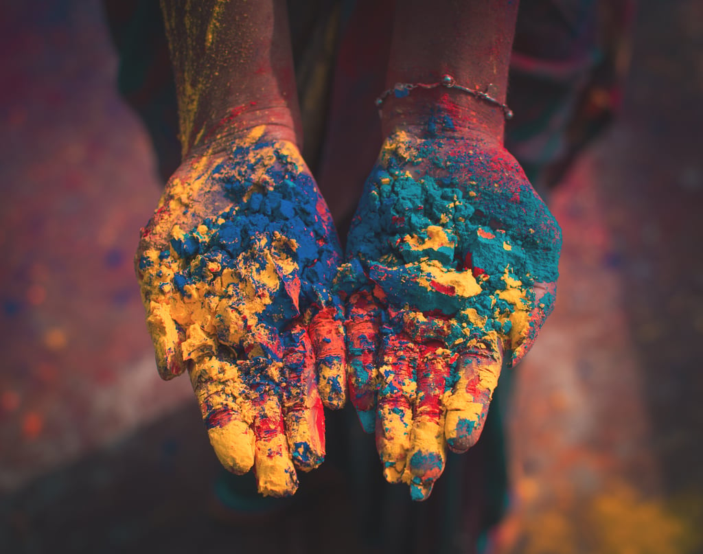 Image of hands holding Holi powder