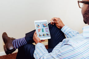 Image of a man viewing graphs