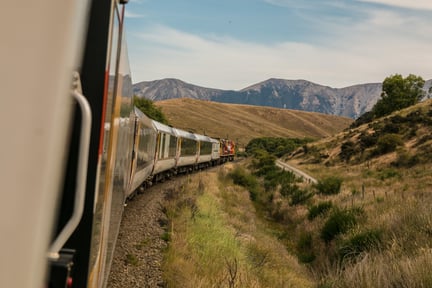 Image of a train traveling through the countryside