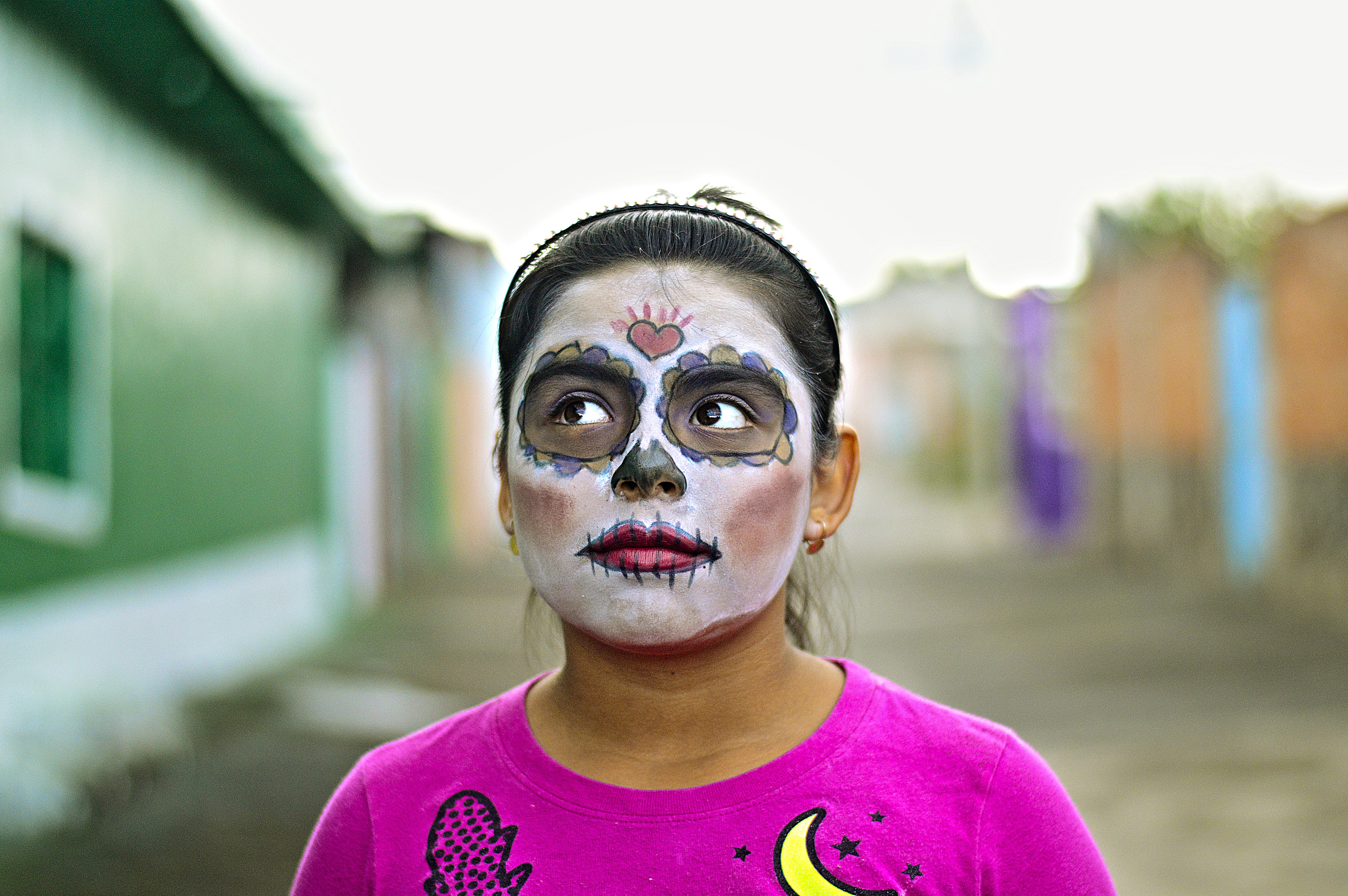 Image of a girl with her face painted to celebrate Dia de Los Muertos in Mexico City