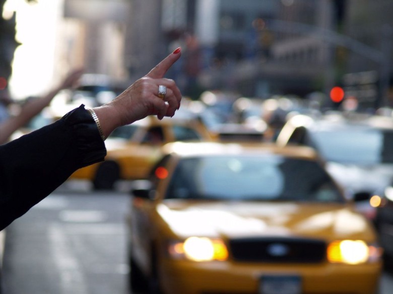 photo of someone hailing a cab