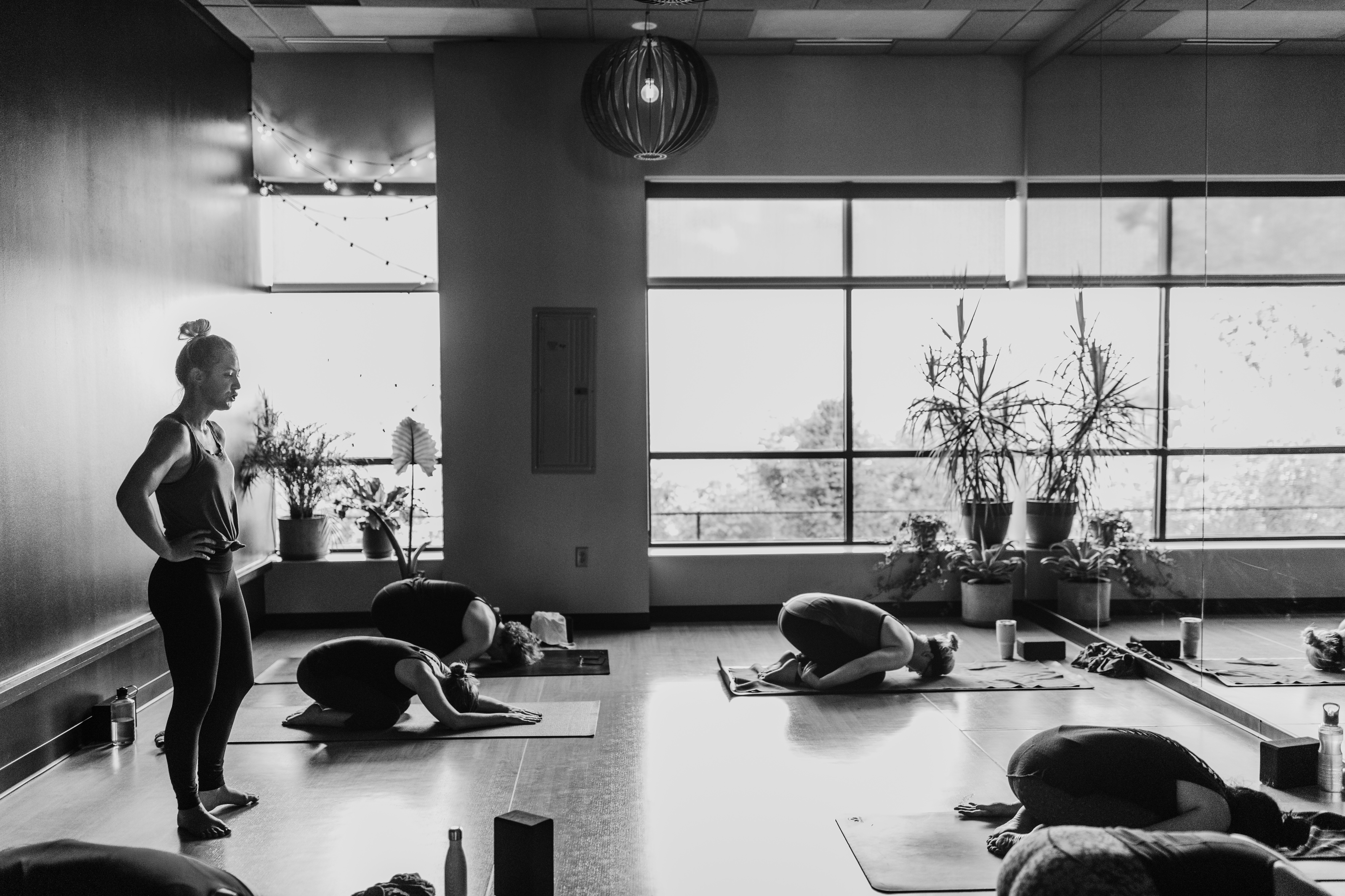 Image of corporate housing residents enjoying a yoga class with locals 