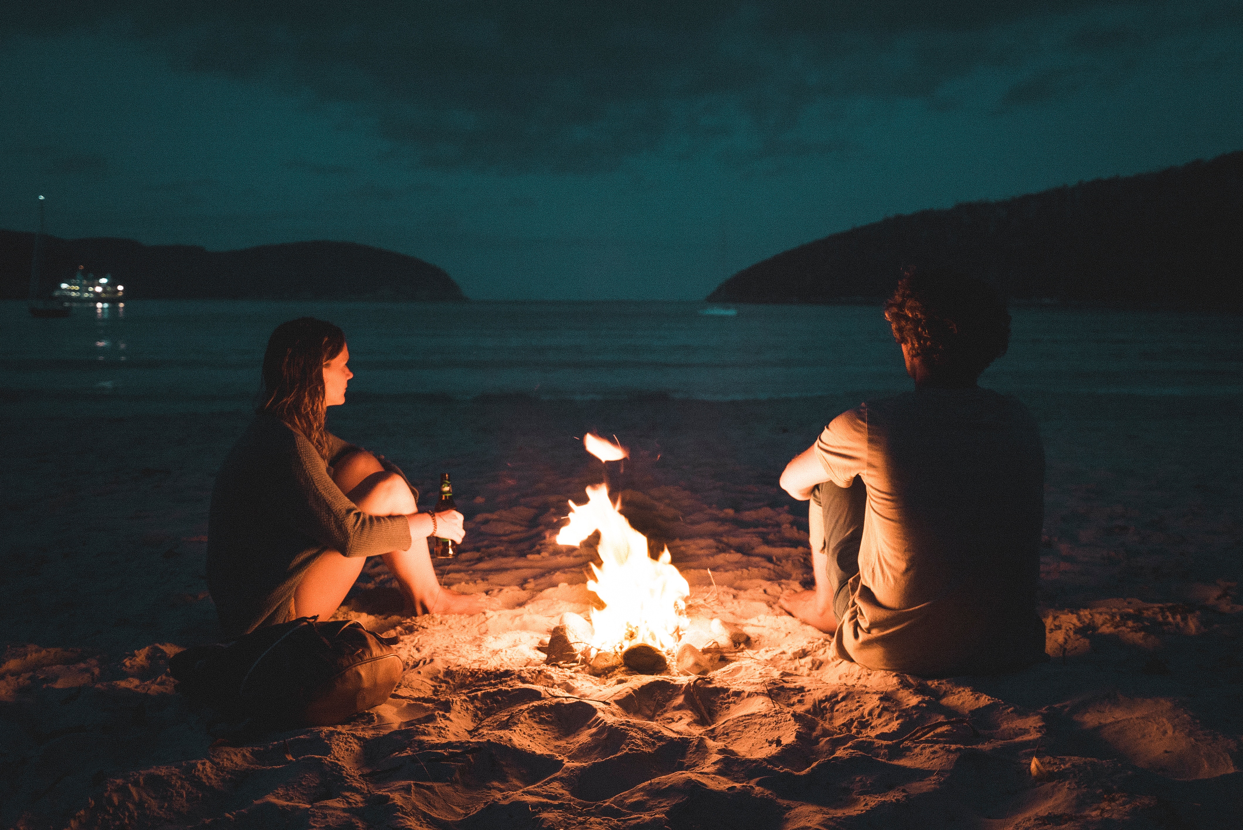 Image of Australians conversing on a beach 