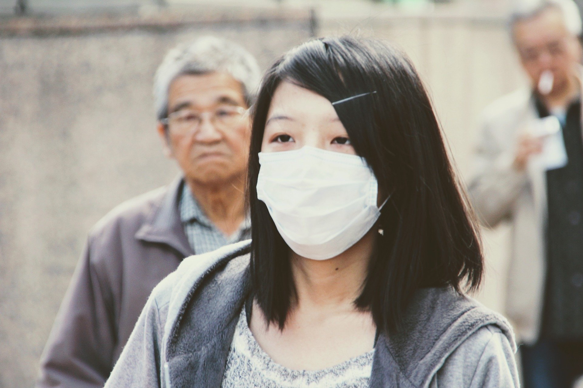 Image of a woman in China wearing a mask