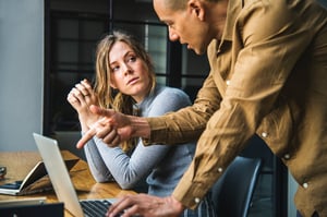 Image of two people having a discussion