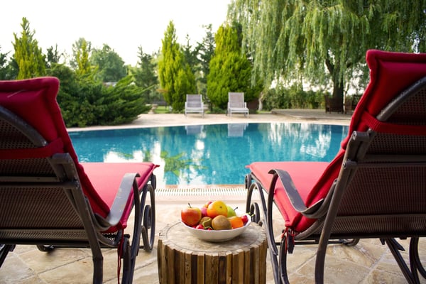 Image of a pool and lounge chairs