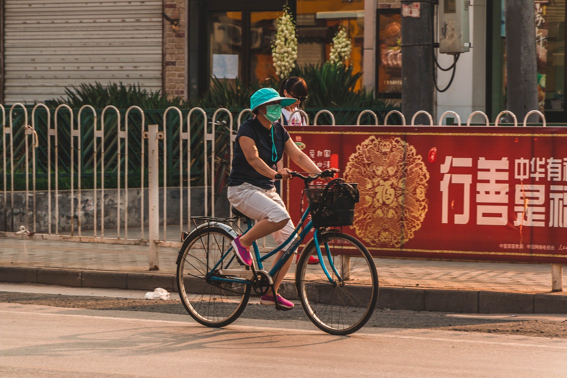 Image of a woman in China wearing a mask