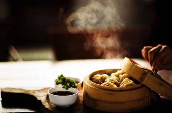 Image of dumplings in a steamer basket