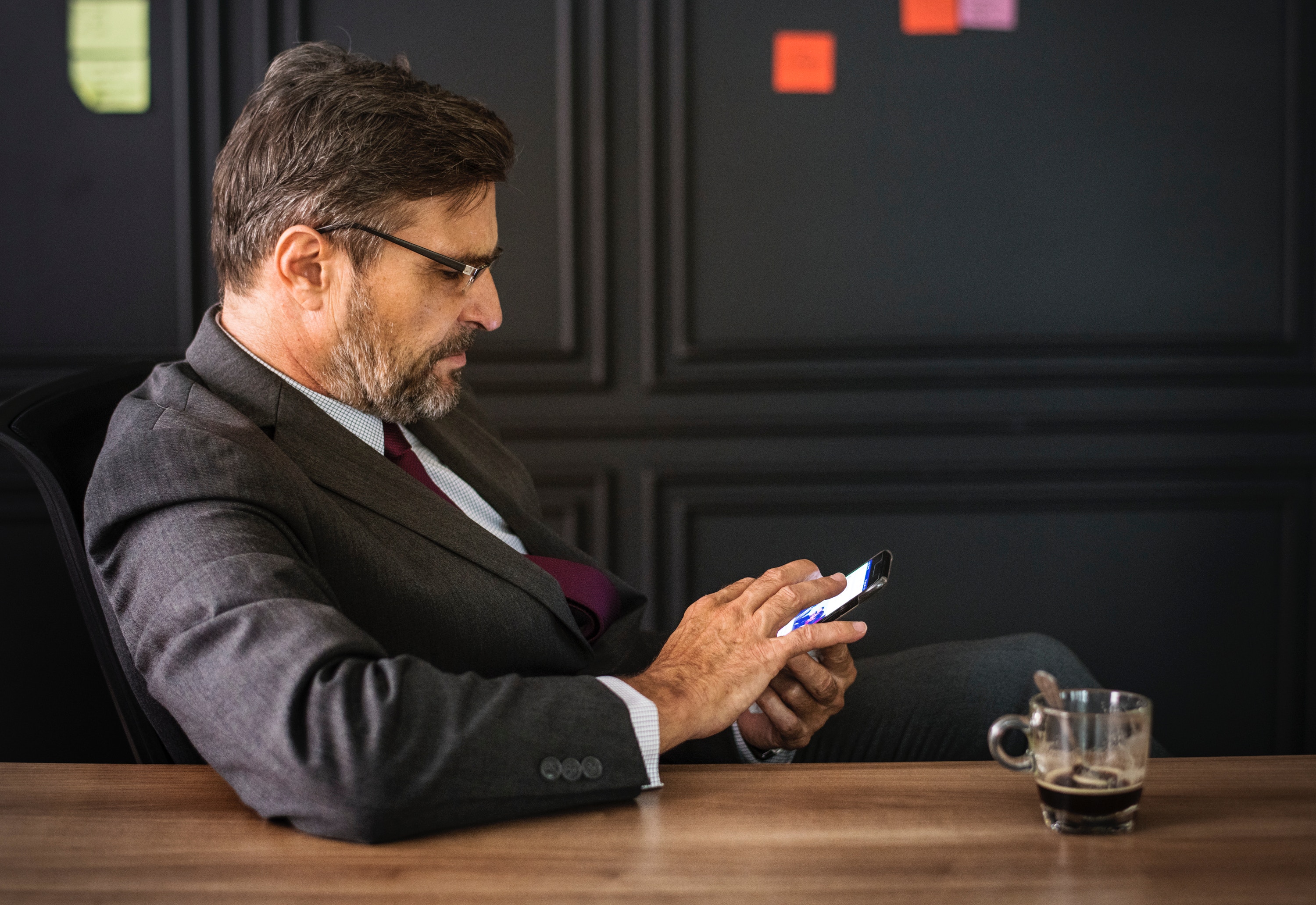 Image of a man booking an apartment on his cell phone