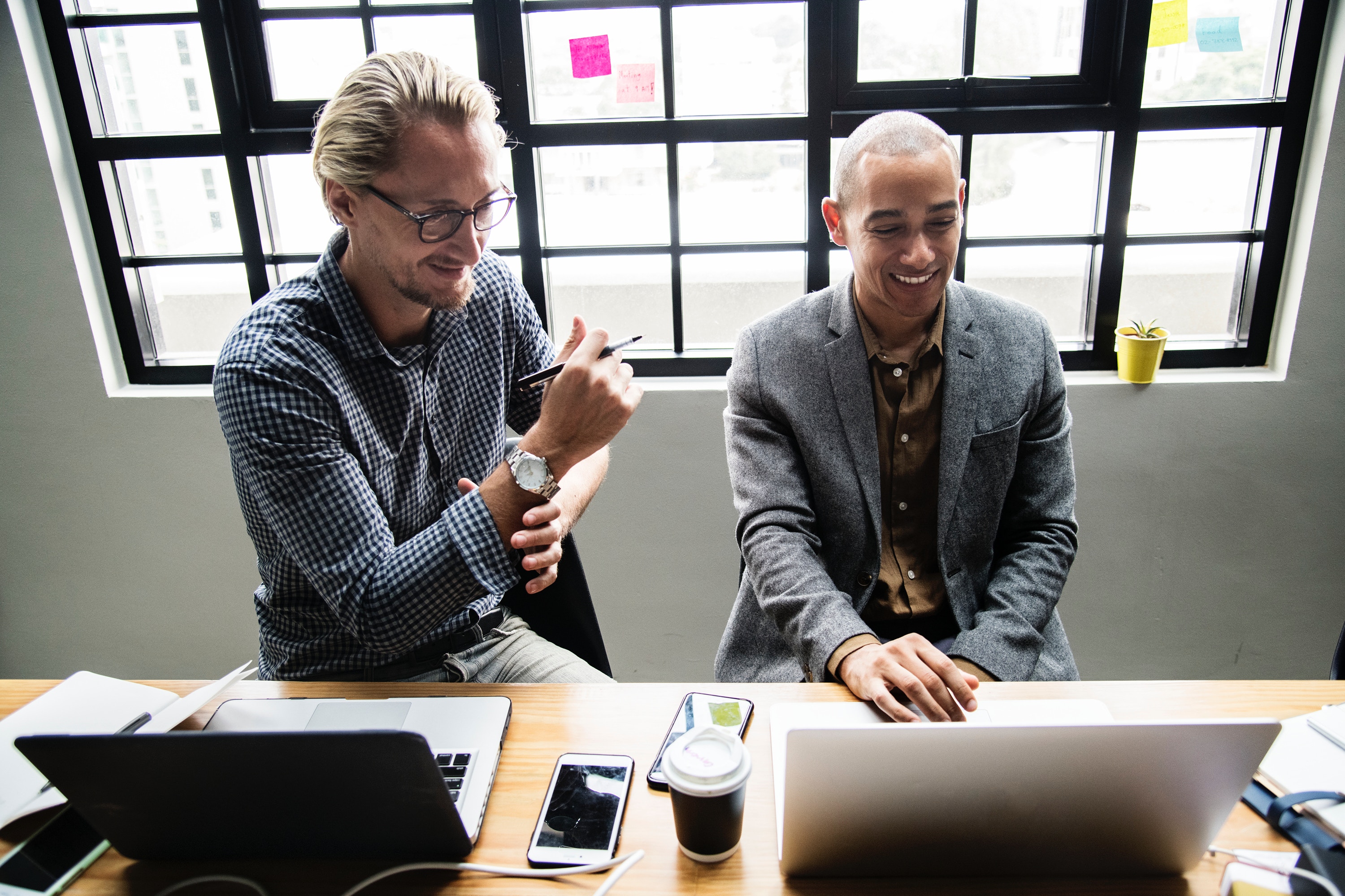 A photo of two men in an office