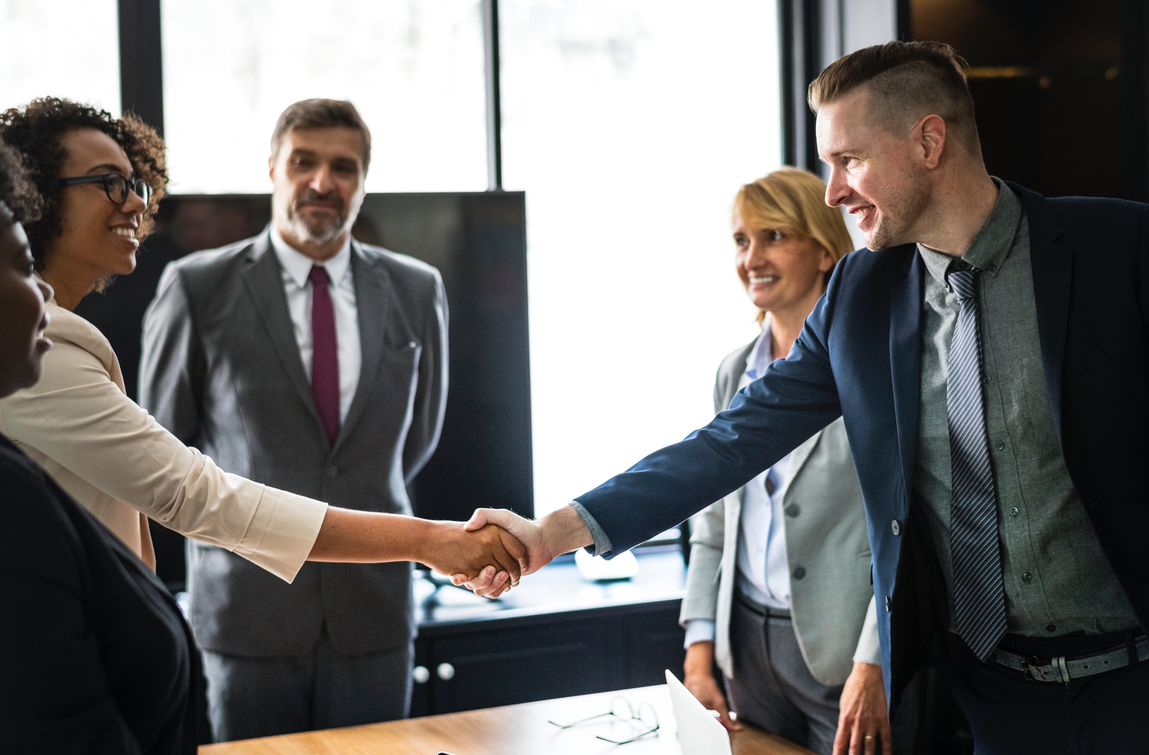 A photo of two people shaking hands