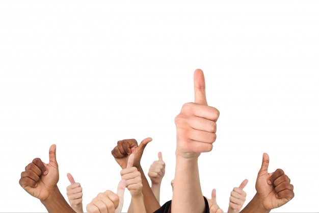 photo of a set of hands doing thumbs up sign